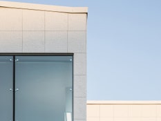 Photo #1 of project A library's facade covered in paper-like texture