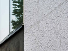 Photo #6 of project A library's facade covered in paper-like texture